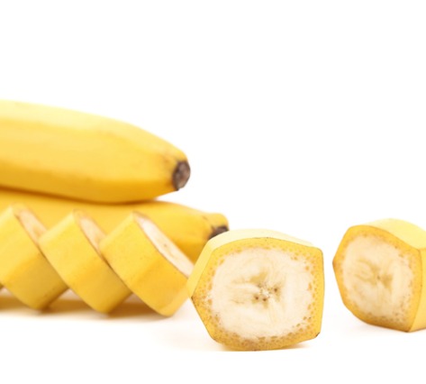 Bananas with slices still in the peel