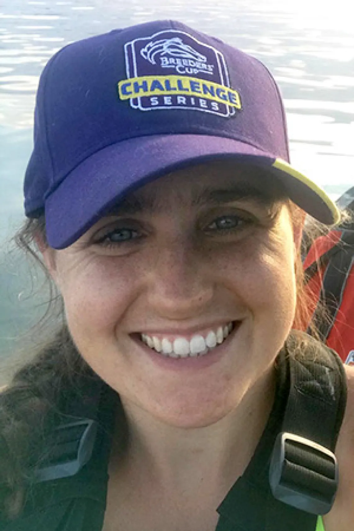 Elizabeth Pepper, smiling, by the water