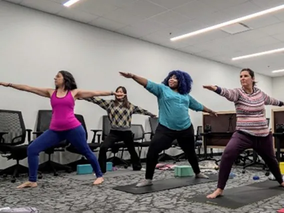 Employees practicing yoga