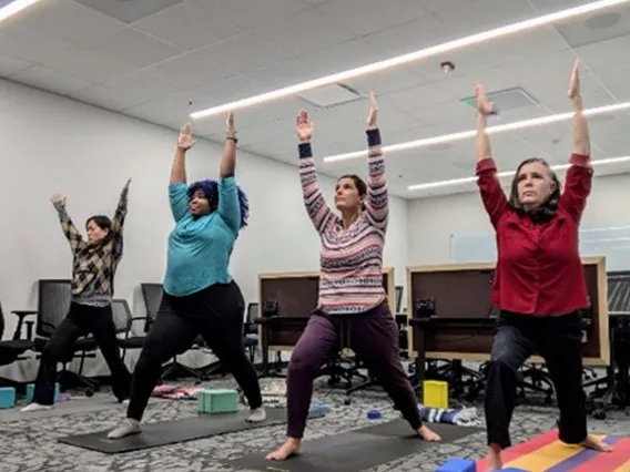 Employees practicing yoga