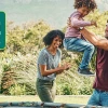 Parents playing with children outdoors in natural setting with 'MOVE YOUR WAY' logo, promoting family physical activity and active lifestyle in beautiful landscape